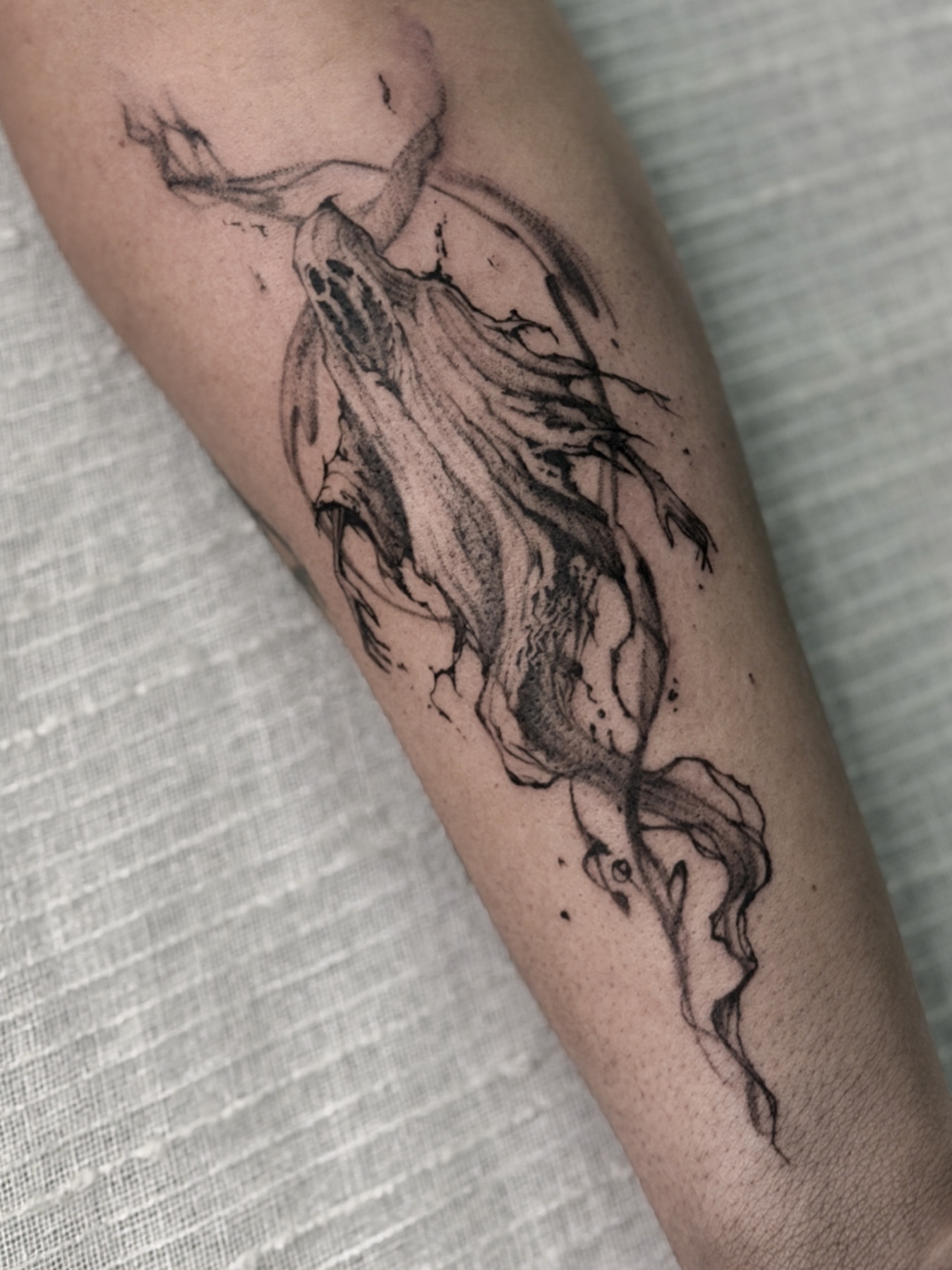 Expressive abstract bat tattoo