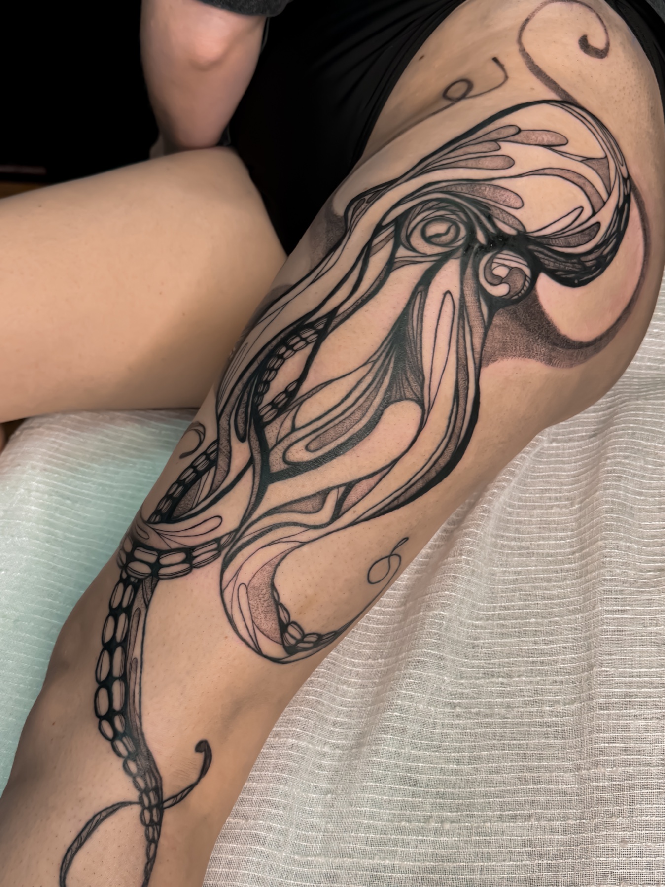 Large-scale abstract octopus leg tattoo