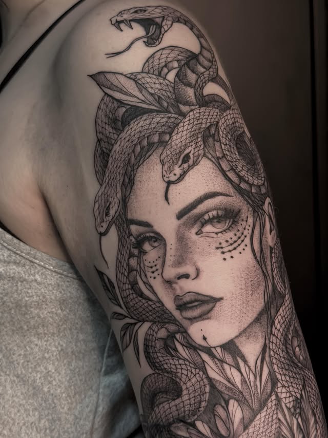 Large-scale Medusa and snakes tattoo